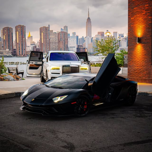 Black Lamborghini Aventador and white Rolls-Royce Cullinan in New York