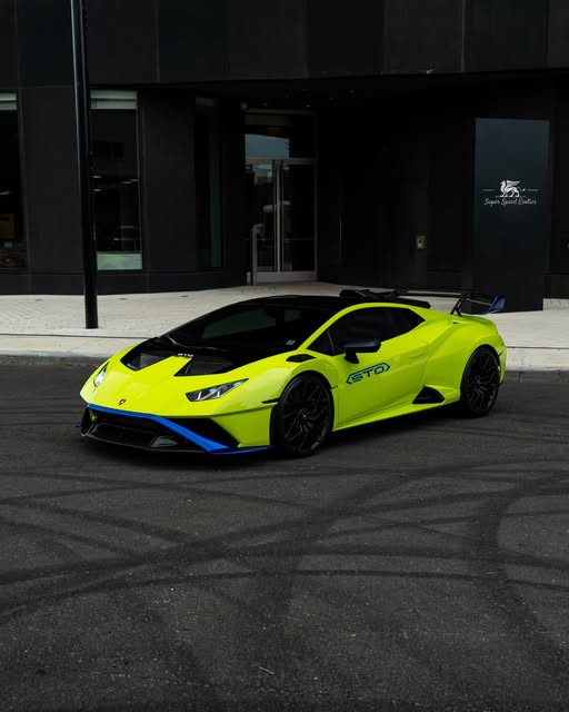 Green Lamborghini Huracán STO outside Super Speed Exotics